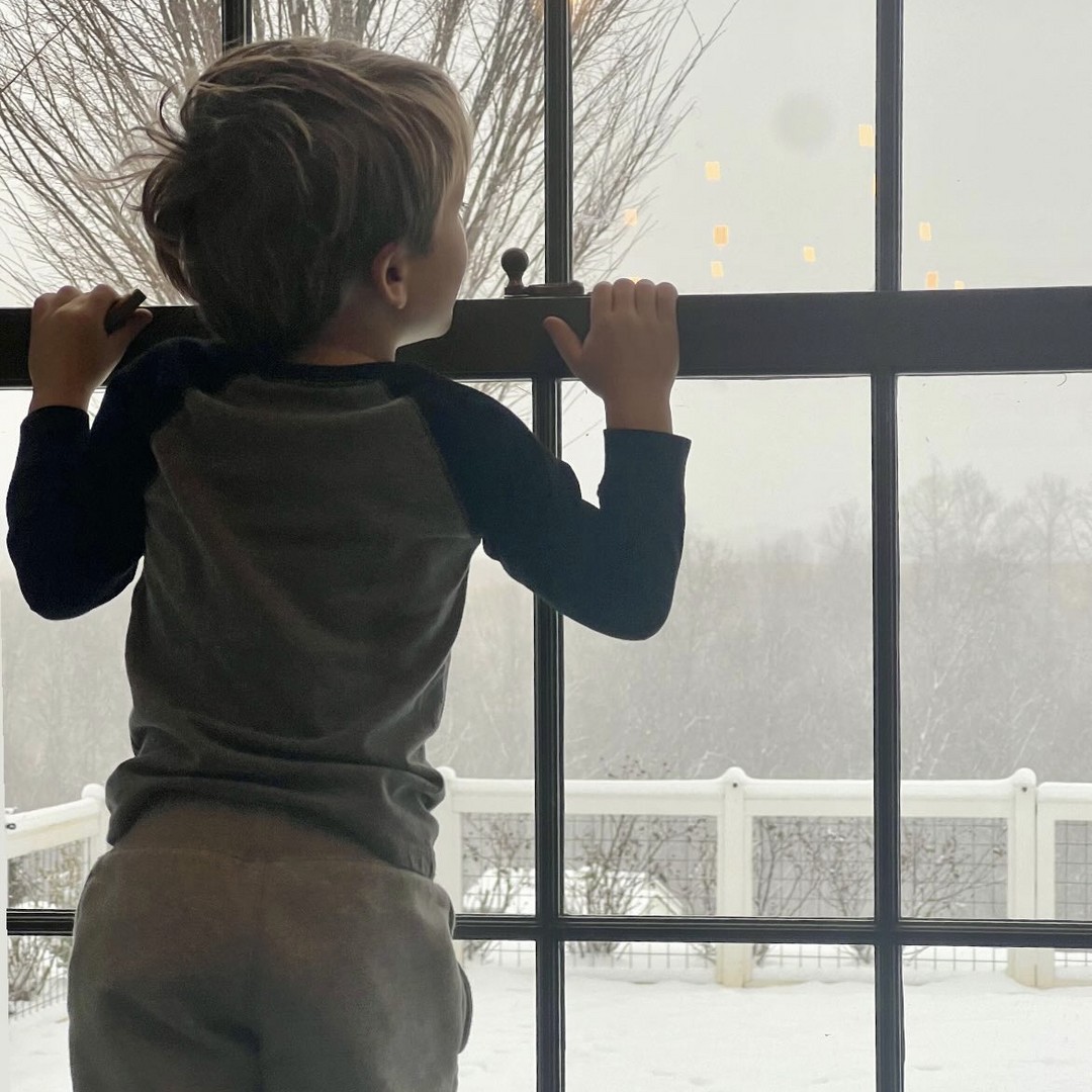 Carrie Underwood's son looks out on the magical scene at their home