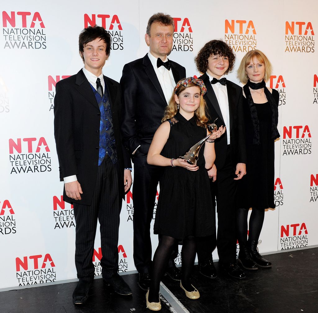 Winners of Situation Comedy Tyger Drew-Honey, Hugh Dennis, Ramona Marquez, Daniel Roche and Claire Skinner pose in front of the winners boards during the National Television Awards 2012 held at the O2 Arena on January 25, 2012 in London, England