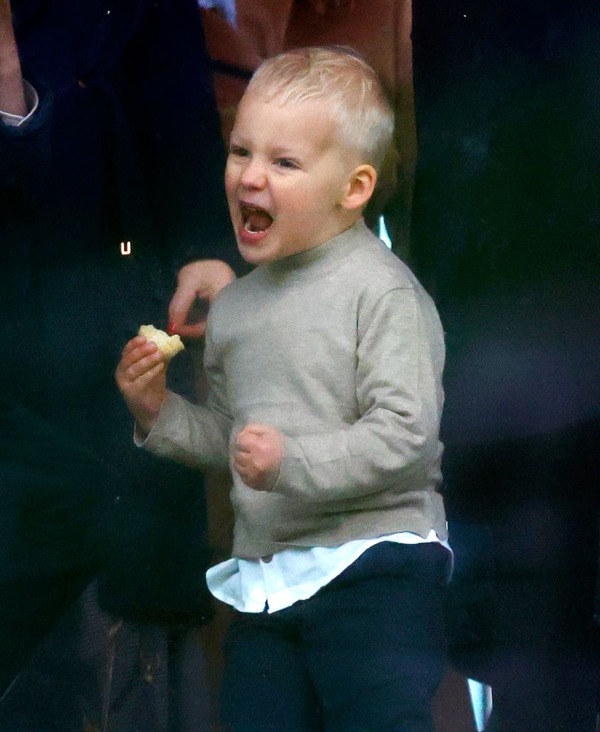 young boy celebrating win at races