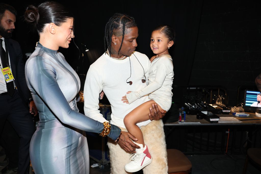 Kylie Jenner, Stormi Webster, and Travis Scott backstage during the 2022 Billboard Music Awards held at the MGM Grand Garden Arena on May 15, 2022. -- (Photo by Christopher Polk/NBC/NBCU Photo Bank via Getty Images)