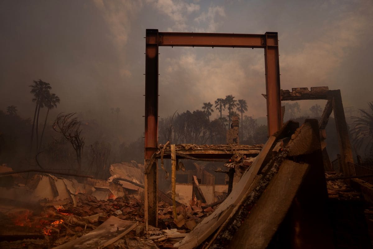 Flames from the Palisades Fire burn a home on January 8, 2025 in Malibu, California. Fueled by intense Santa Ana Winds, the Palisades Fire has grown to over 2,900 acres, and 30,000 people have been ordered to evacuate while a second major fire continues to burn near Eaton Canyon in Altadena. 