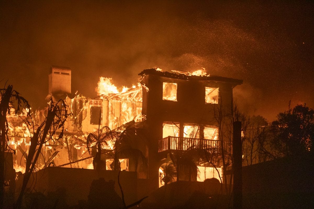 The Palisades Fire burns homes on the Pacific Coast Highway amid a powerful windstorm 