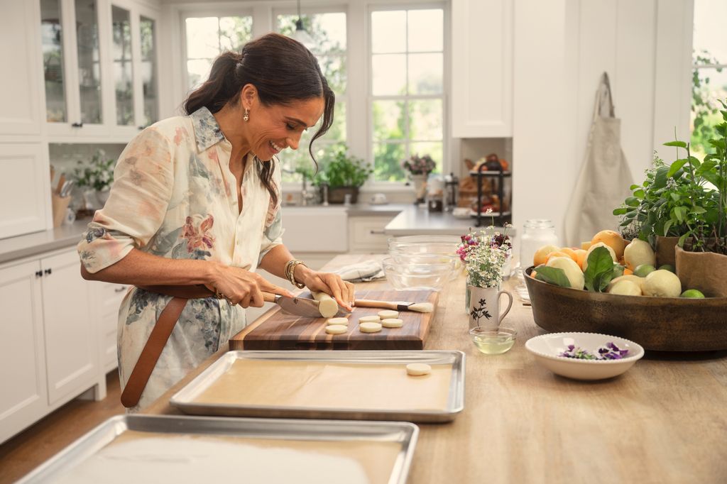 Meghan, Duchess of Sussex in episode 108 of With Love, Meghan cutting fruit inside a kitchen