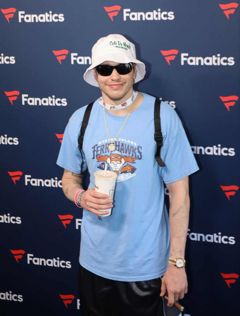 photo of pete davidson holding a cup