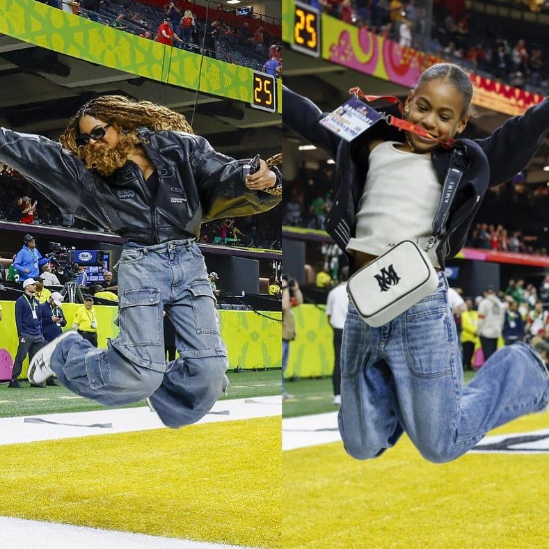Rumi and Blue Ivy Carter jumping at the Super Bowl