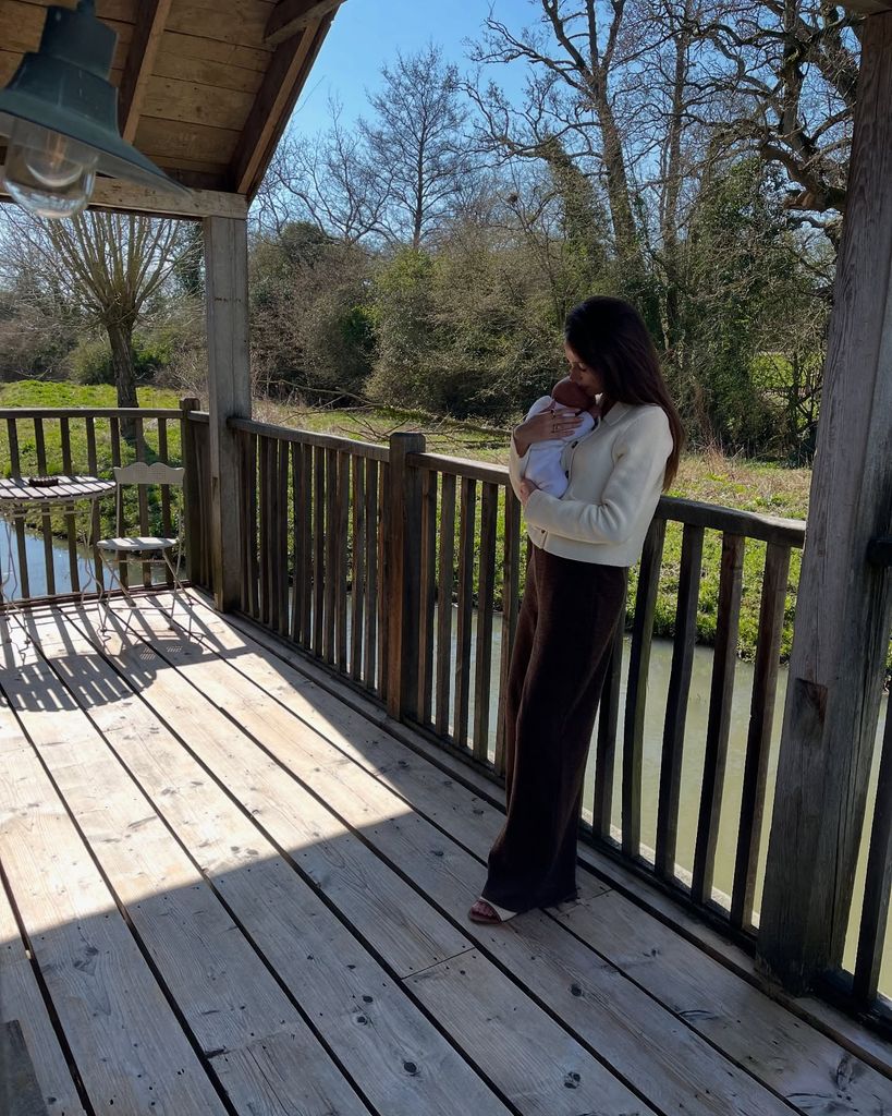Michelle Keegan kissing her newborn baby on the head whilst at Soho Farmhouse