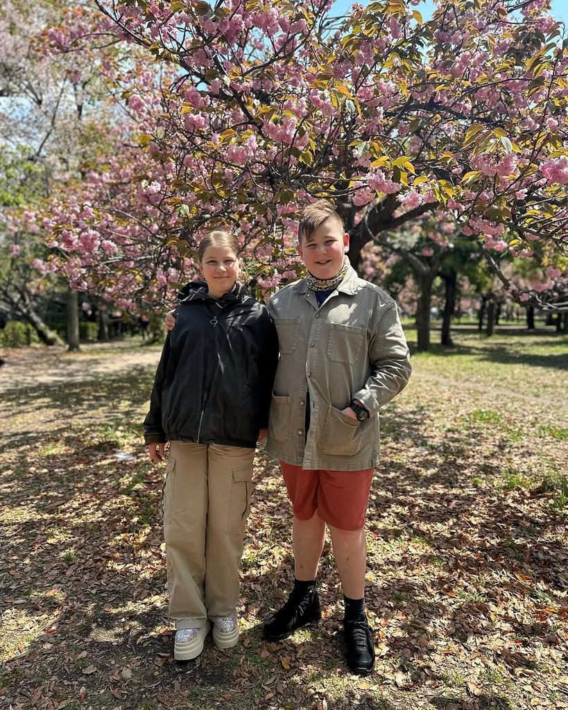 Dorothy and Arthur Strawbridge underneath a blossom tree posing for a photo