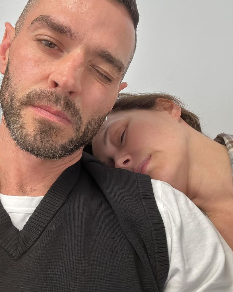 Emma Willis with her head on Matt Willis' shoulder