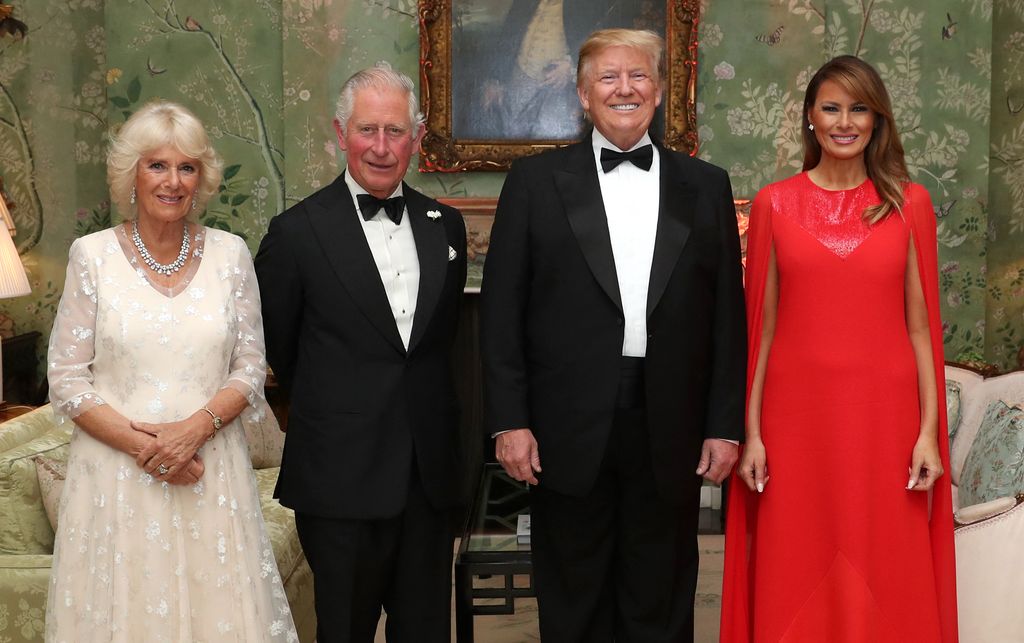 US President Donald Trump (2R), US First Lady Melania Trump (R), Britain's Prince Charles,  and Camilla, Duchess of Cornwall, pose for a photograph ahead of a dinner at Winfield House in 2019