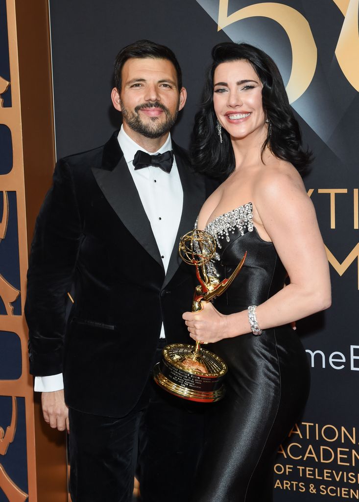 Elan Ruspoli and Jacqueline MacInnes Wood pose with her Emmy Award for Lead Performance in a Daytime Drama Series: Actress at the 50th Annual Daytime Emmy Awards 