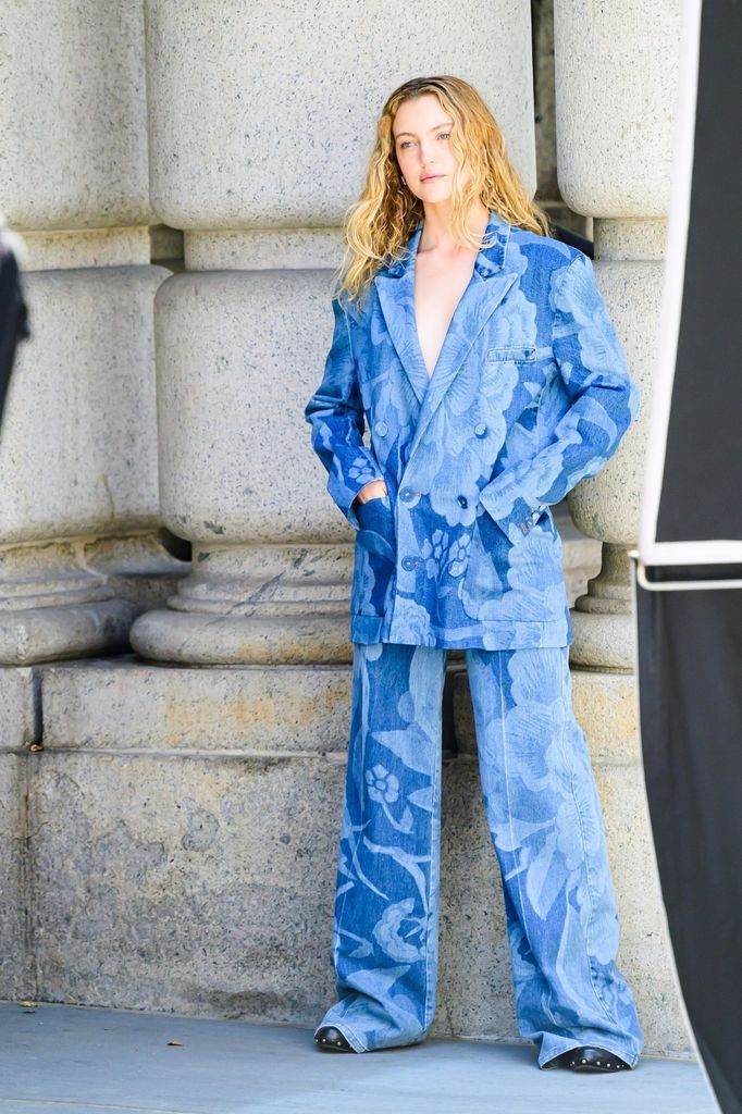 Kai Schreiber in blue pantsuit photo shoot