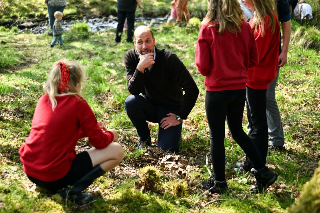 prince william talking to group of students 