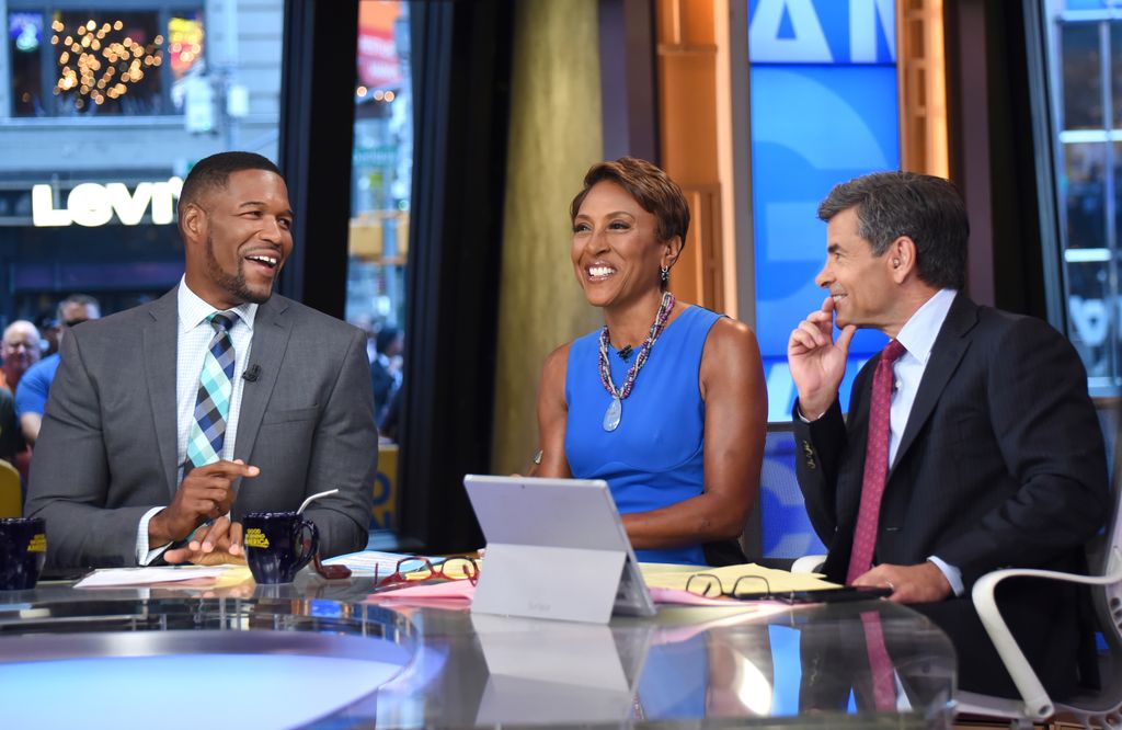 Robin Roberts, MIchael Strahan, George Stephanopoulos on the GMA set