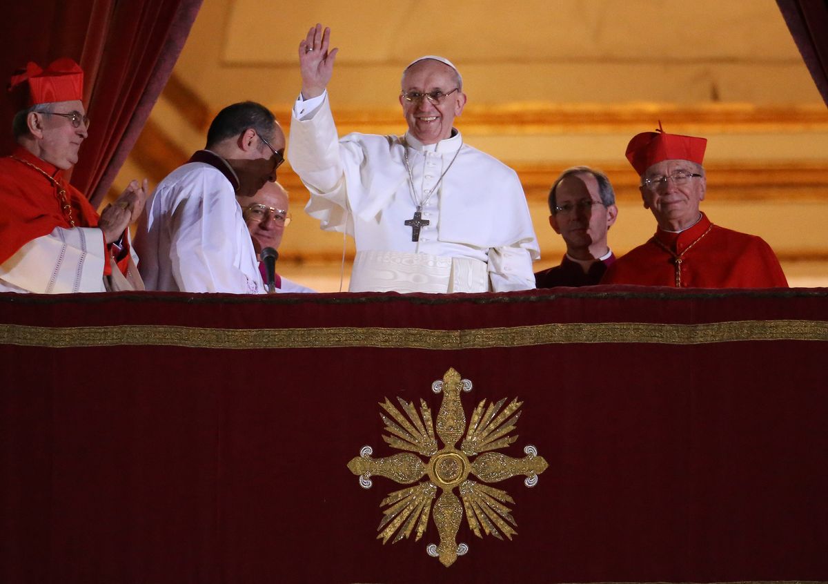 Pope Francis waves to the crowd from St. Peter’s Basilica after his election on March 13, 2013. The former Cardinal Jorge Mario Bergoglio became the first Latin American Pope.