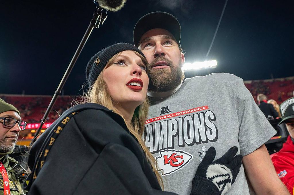 Taylor Swift and Kansas City Chiefs tight end Travis Kelce (87) walk off the field after the trophy ceremony following the Chiefs 32-29 victory over the Buffalo Bills in the AFC Championship Game on Sunday, Jan. 26, 2025, at GEHA Field at Arrowhead Stadium