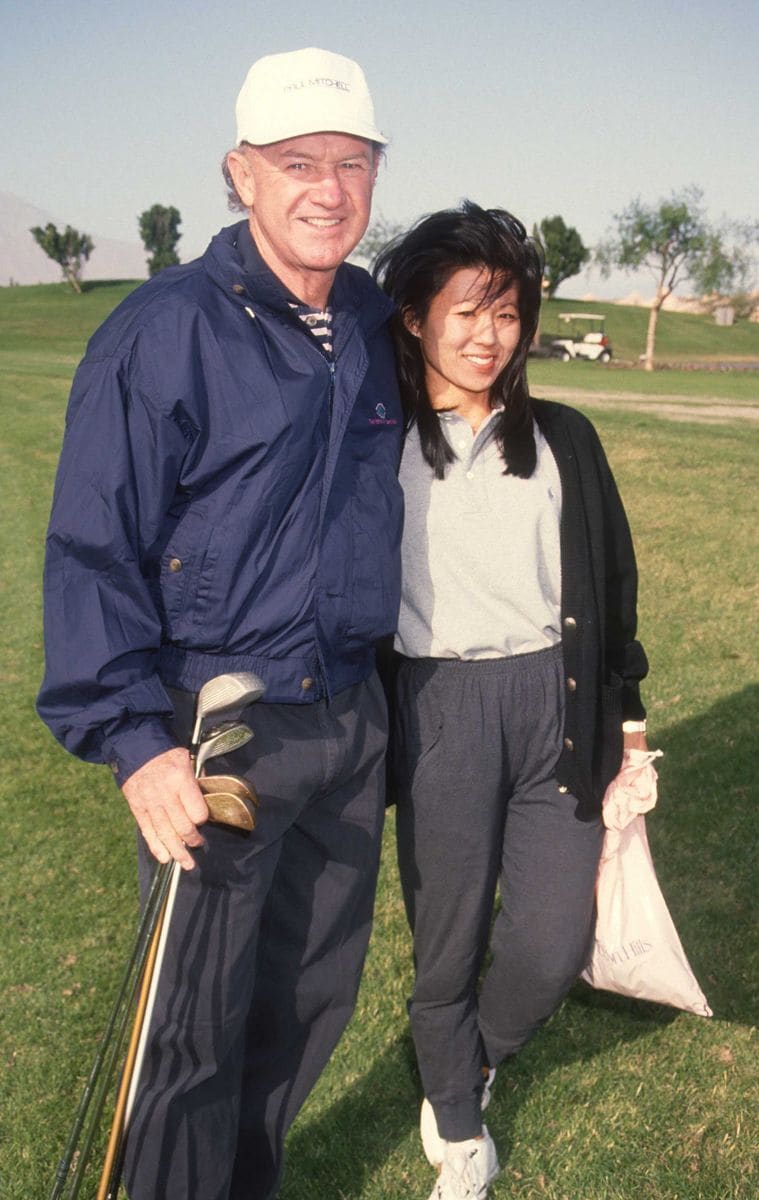 American couple, actor Gene Hackman and Classical musician Betsy Arakawa, attend the Mission Hills Celebrity Sports Invitational, Rancho Mirage, California, November 30, 1991. (Photo by Ron Galella, Ltd./Ron Galella Collection via Getty Images) 
