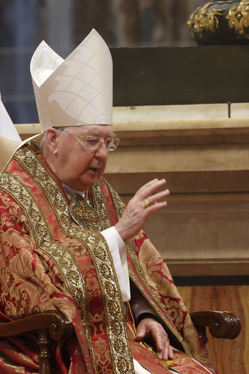 
Cardinal Camerlengo Kevin Joseph Farrell addresses the audience as he sits in front of the open casket containing the body of Pope Francis in St. Peter's Basilica at the Vatican on April 23, 2025.