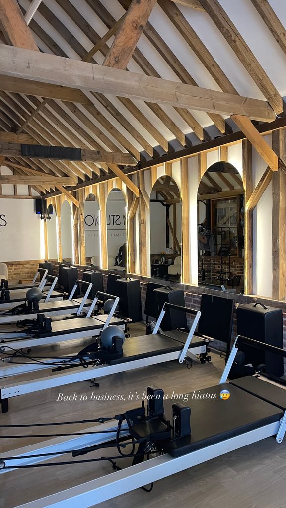 A photo of a bright reformer Pilates studio