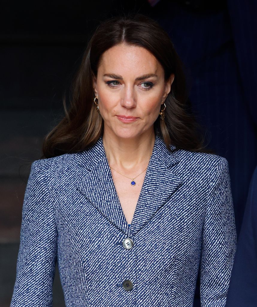 Kate Middleton looking sad in an outfit