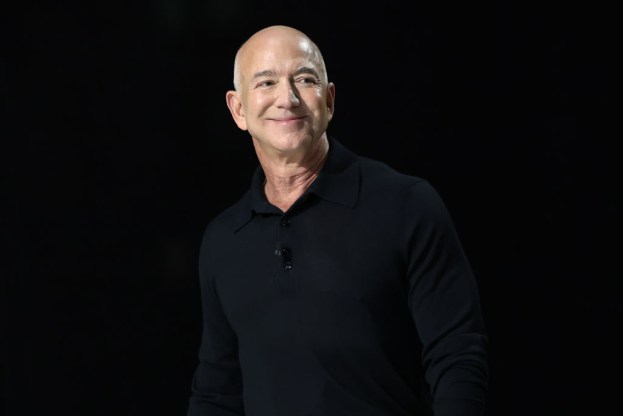 NEW YORK, NEW YORK - DECEMBER 04: Jeff Bezos, founder and executive chairman of Amazon and owner of the Washington Post, takes the stage during the New York Times annual DealBook summit at Jazz at Lincoln Center on December 04, 2024 in New York City. The NYT summit with Ross Sorkin returns with interviews on the main stage including Sam Altman, co-founder and C.E.O. of OpenAI, Jeff Bezos, founder and executive chairman of Amazon and owner of the Washington Post, former U.S. President Bill Clinton and Prince Harry, The Duke of Sussex, among others. The discussions will touch on topics such as business, politics and culture. (Photo by Michael M. Santiago/Getty Images)
