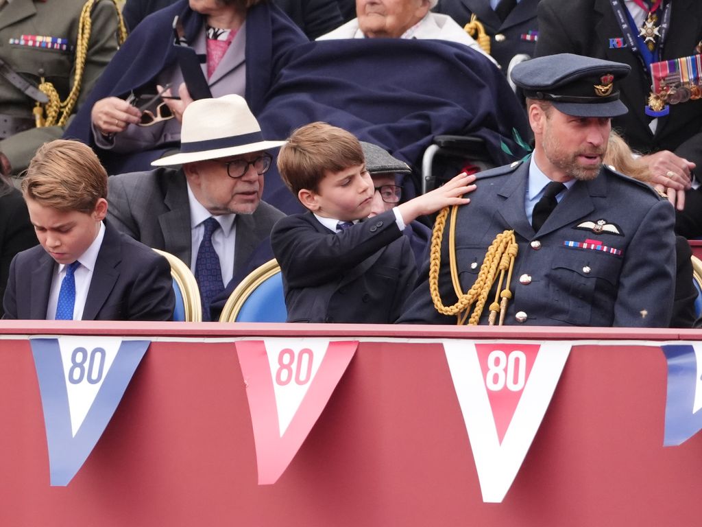 Louis taps William on the shoulder