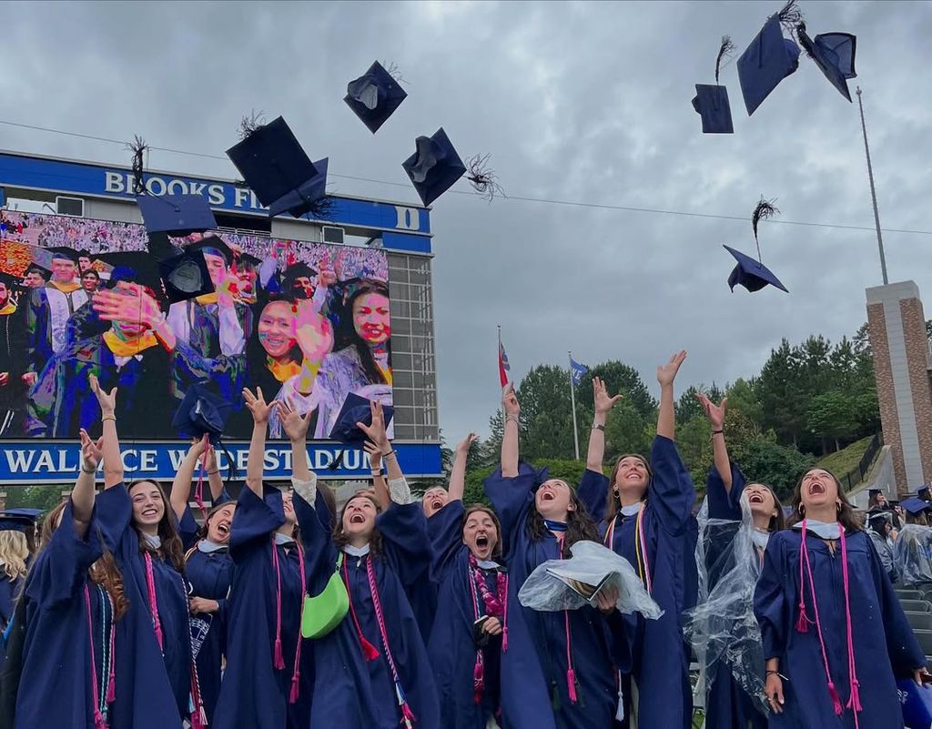 Esmé Annabelle Fox joins other Duke University graduates in throwing their caps into the air, shared on Instagram