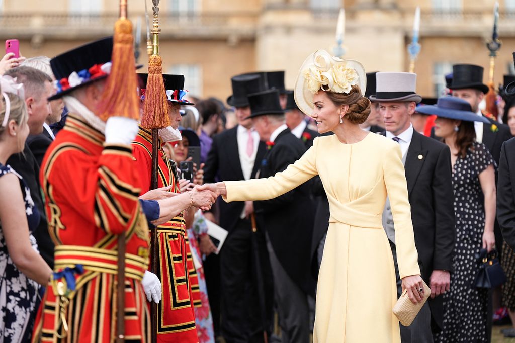 Britain's Catherine, Princess of Wales meets with guests during a Royal Garden Party at Buckingham Palace, in London, on May 20, 2025