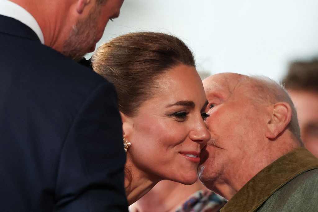 Kate Middleton receives kiss on cheek