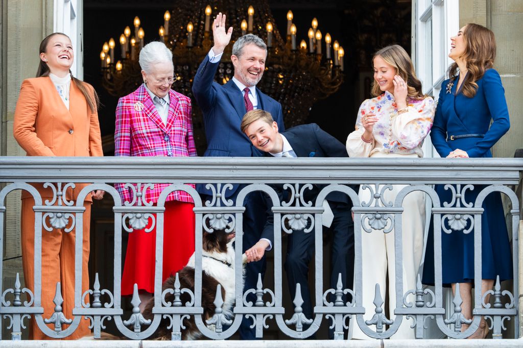 Princess Isabella, Queen Margrethe, King Frederik, Prince Vincent, Princess Josephine, Queen Mary and one of the royal dogs appear on the balcony