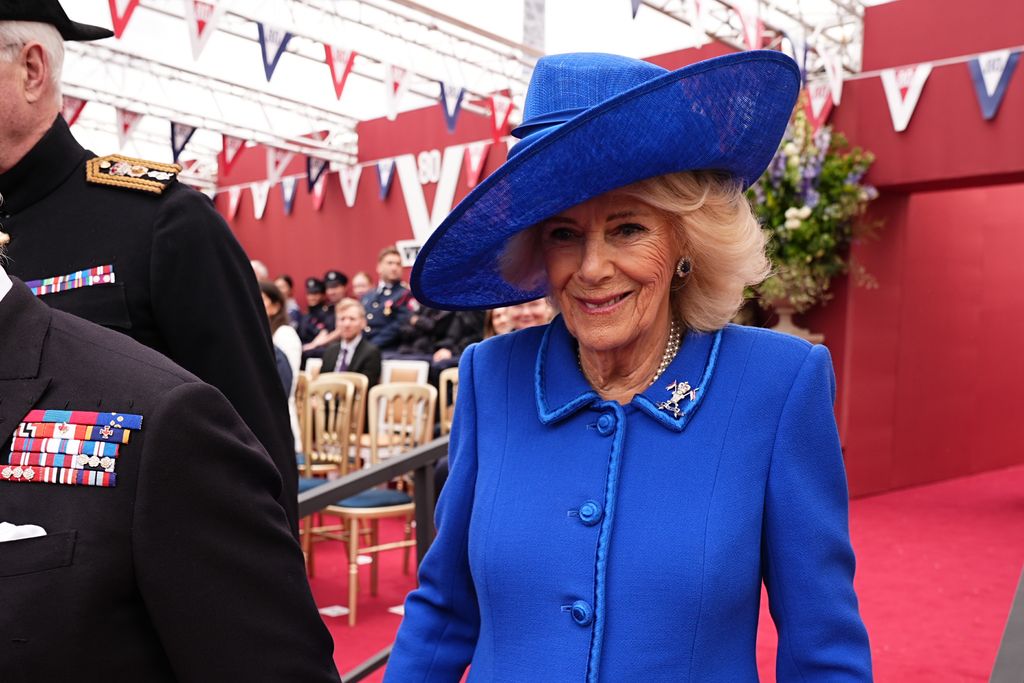 Queen Camilla wearing blue outfit on VE Day