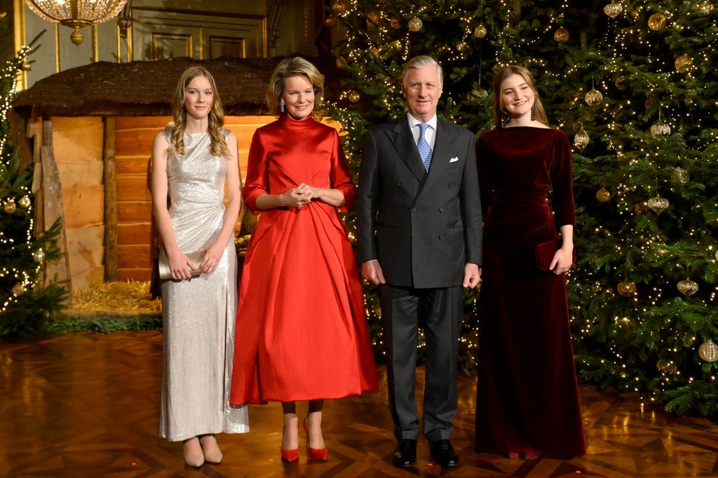 King Philippe of Belgium and Queen Mathilde of Belgium, Princess Eleonore of Belgium and Princess Elisabeth posing in front of the Christmas tree in 2024