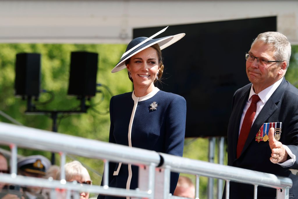 The Princess of Wales in navy hat and dress
