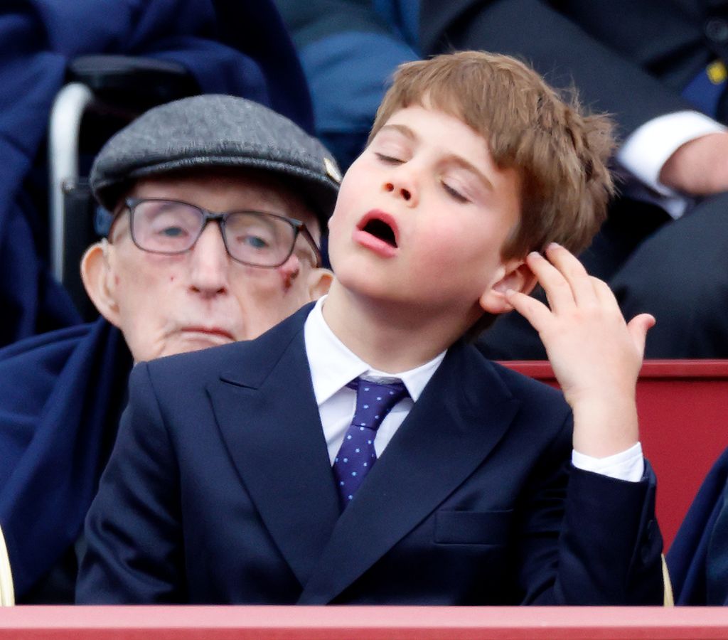 Prince Louis of Wales appears to mock his brother Prince George of Wales by copying him sweeping his hair back