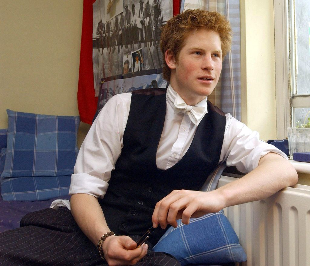 Prince Harry, the younger son of the Prince of Wales, sits in his room at Eton College