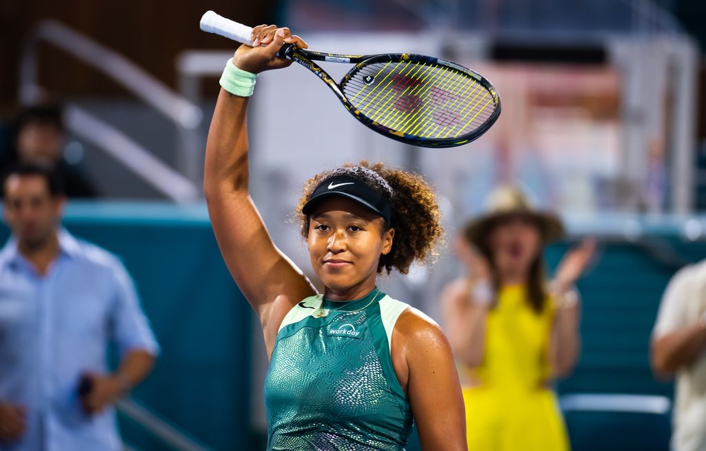 naomi osaka on tennis court 