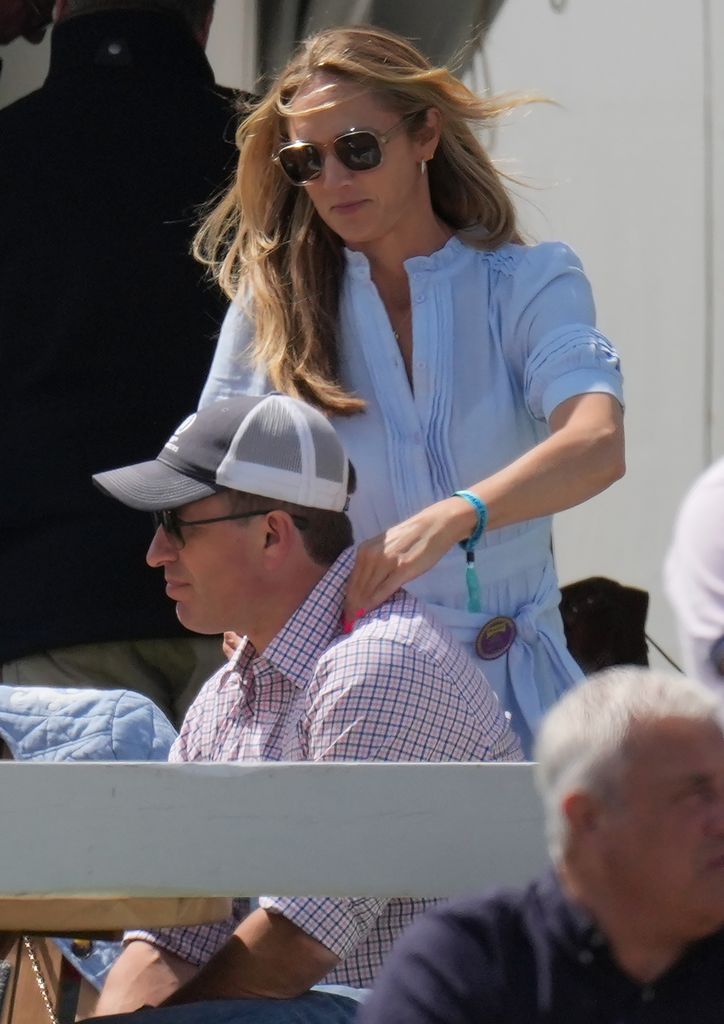 woman giving boyfriend shoulder massage