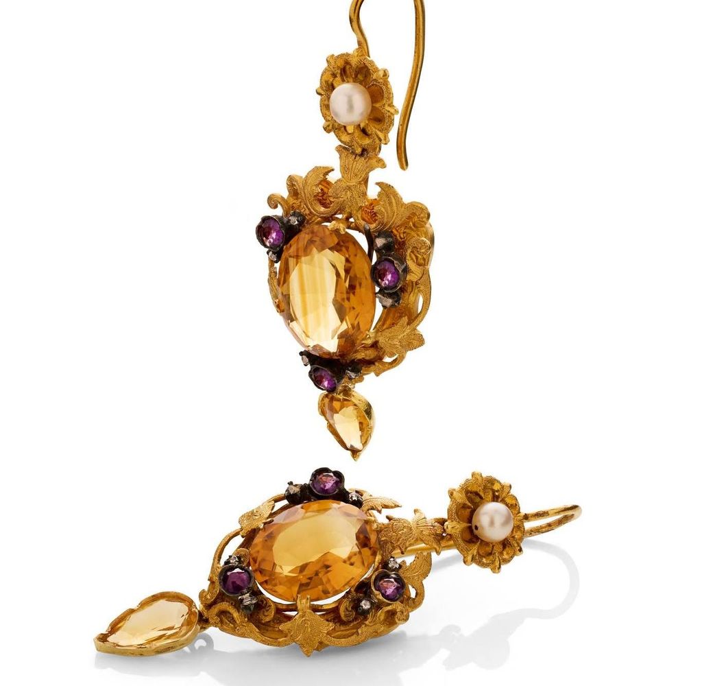 pair of antique earrings with yellow stones 