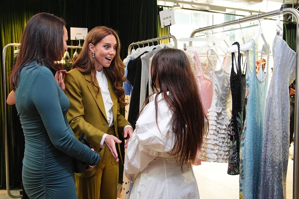 kate talking to group of people