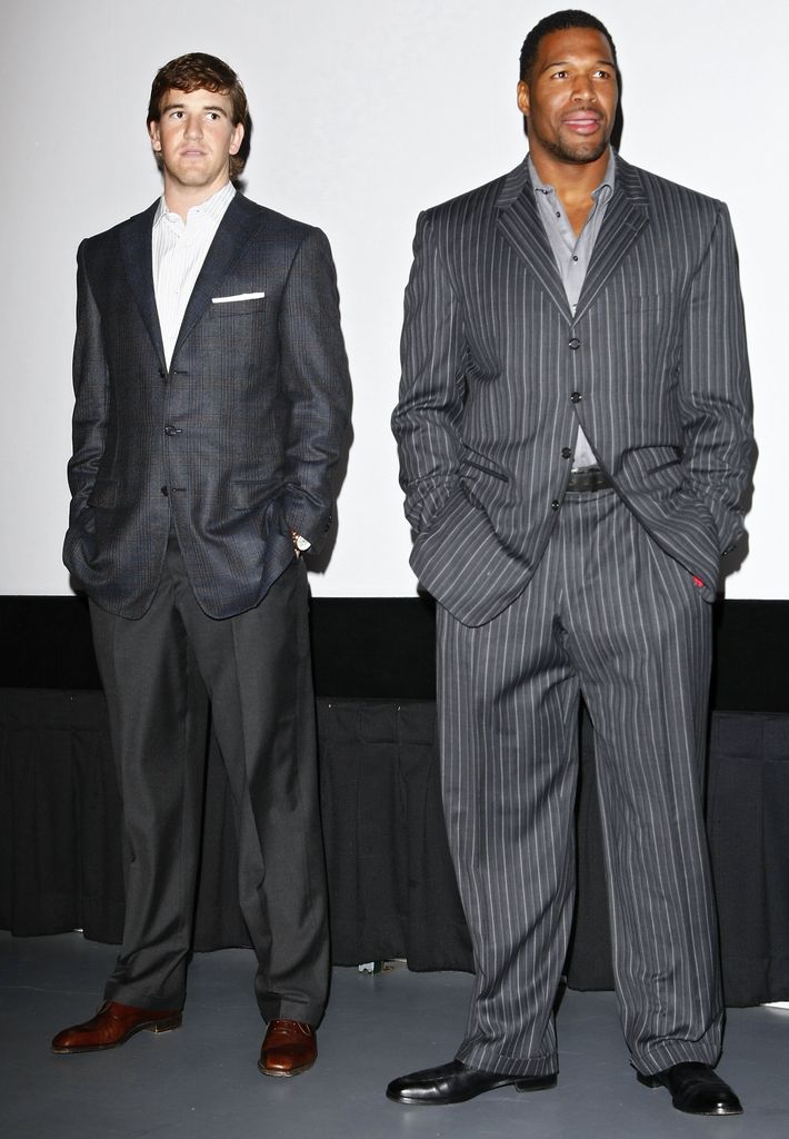 Michael standing alongside Eli