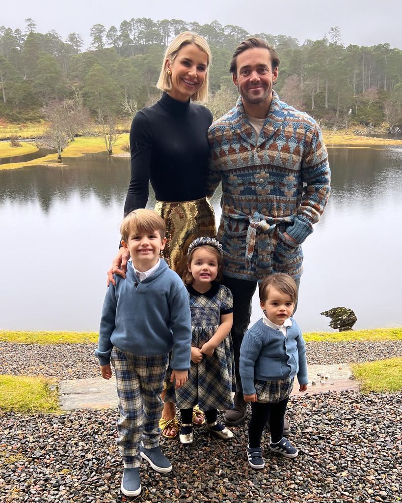 Vogue, spencer and kids posing in front of lake