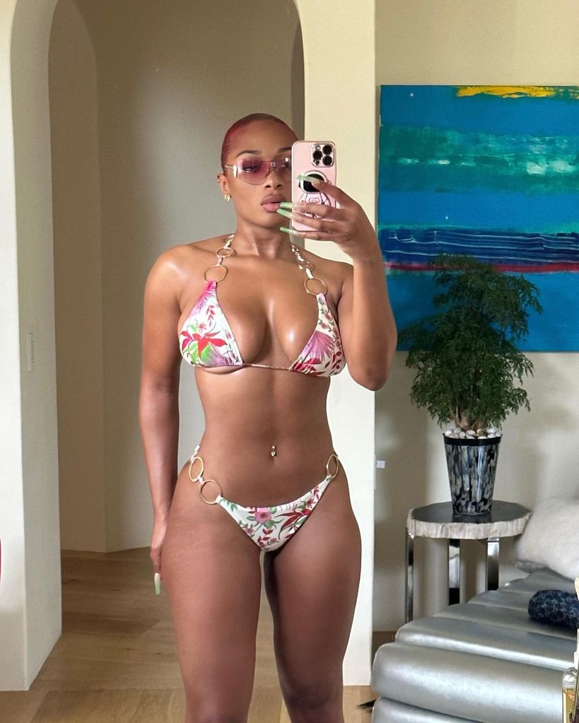 Megan Thee Stallion wearing white and pink tropical bikini 