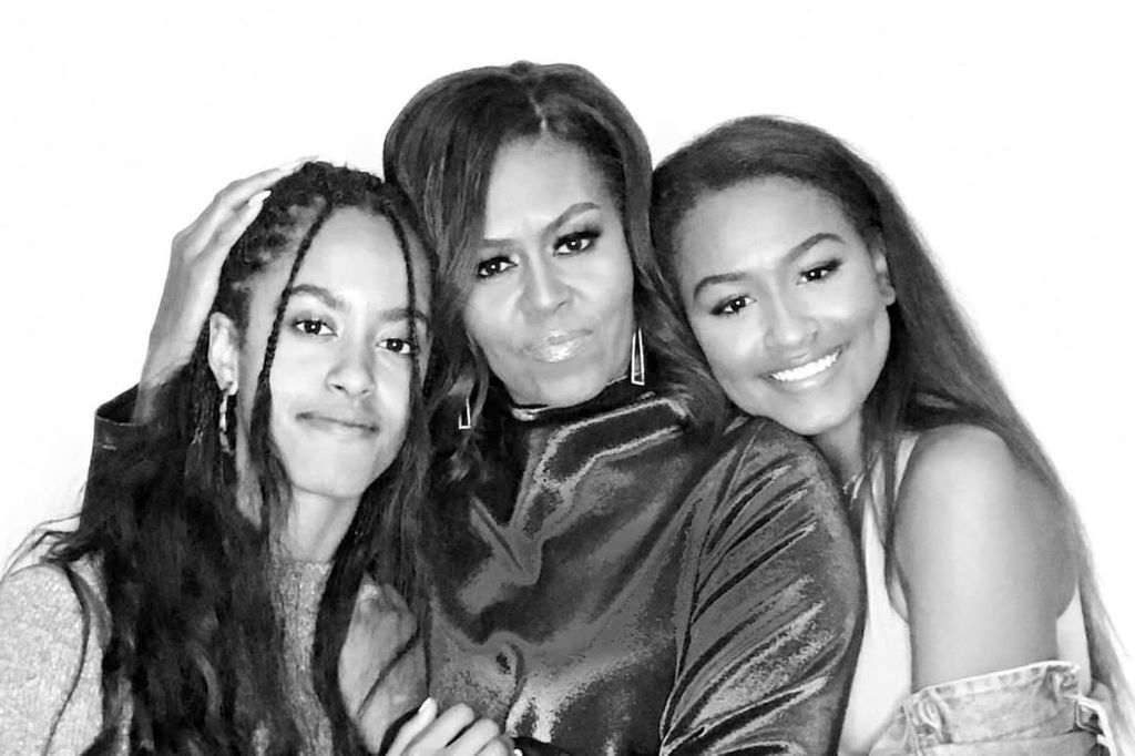 Michelle Obama embraced by daughters Malia and Sasha Obama in an archival photo shared on Instagram by Barack Obama