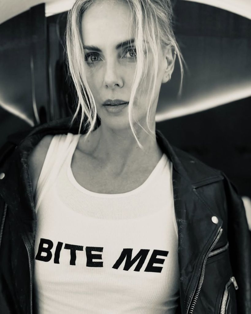 Charlize Theron poses in a t-shirt sporting the words "Bite Me" for a photo shared on Instagram