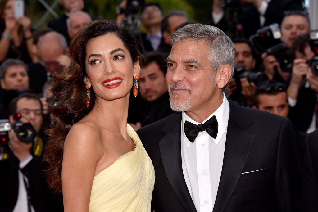 George Clooney and his wife Amal Clooney attend the "Money Monster" premiere during the 69th annual Cannes Film Festival at the Palais des Festivals on May 12, 2016 in Cannes, France.  (Photo by Clemens Bilan/Getty Images)