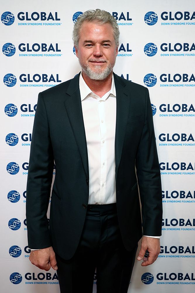 Eric Dane wearing a navy suit
