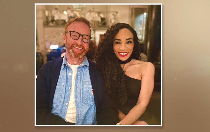man and woman posing in restaurant