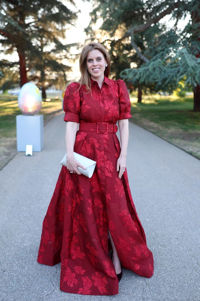 Princess Beatrice in a red dress with floral patterns