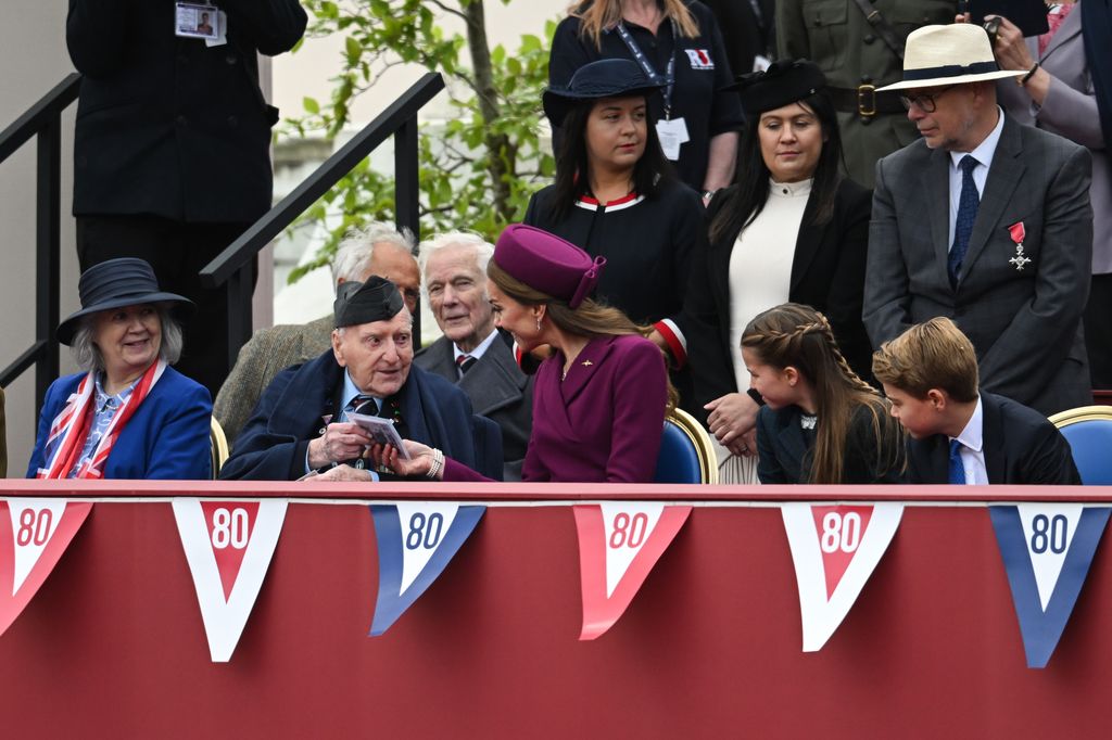 Kate, Charlotte and George speaking to veteran
