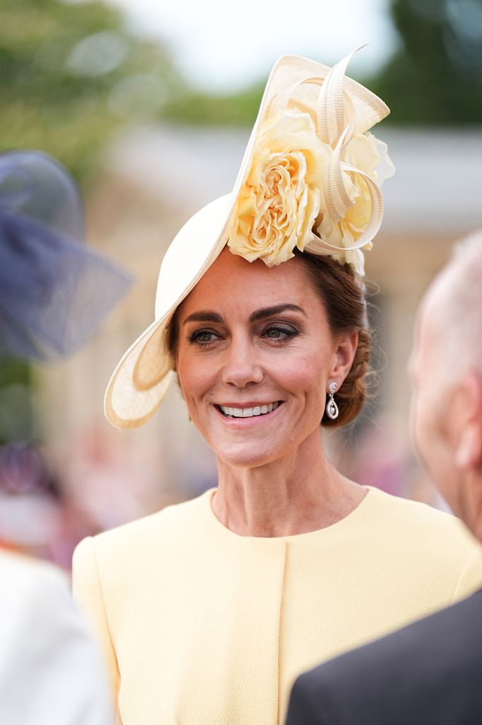 Britain's Catherine, Princess of Wales meets with guests during a Royal Garden Party at Buckingham Palace, in London, on May 20, 2025