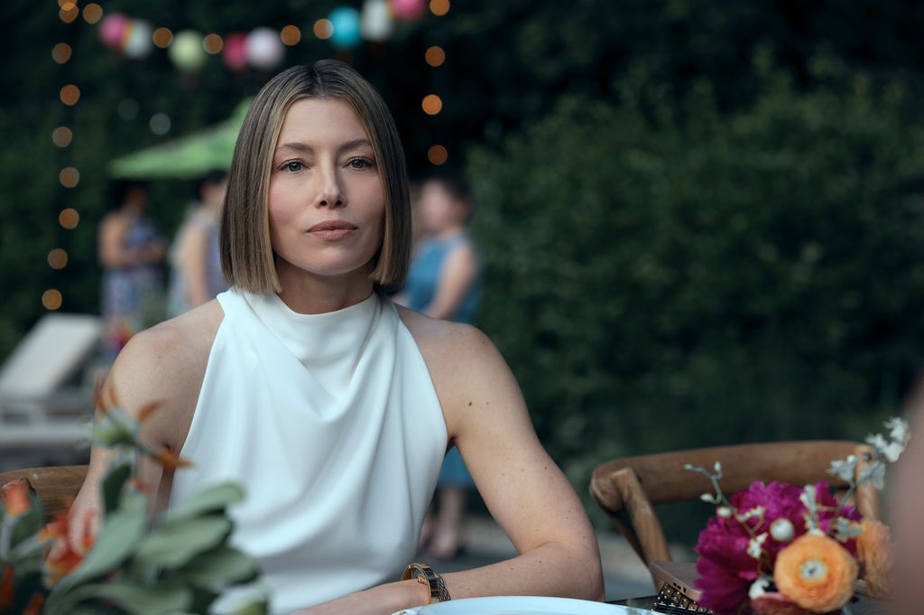 close-up of woman wearing white dress at party